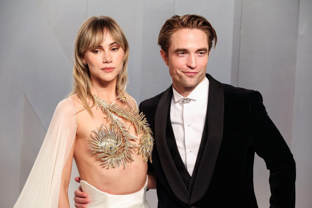 MUSEUM ROW MIRACLE MILE LOS ANGELES CALIFORNIA USA - MARCH 15 Suki Waterhouse wearing Tamara Ralph and boyfriend Robert Pattinson wearing Dior arrive at the 2026 Vanity Fair Oscar Party 98th Annual Academy Awards Hosted By Mark Guiducci held at the - Story